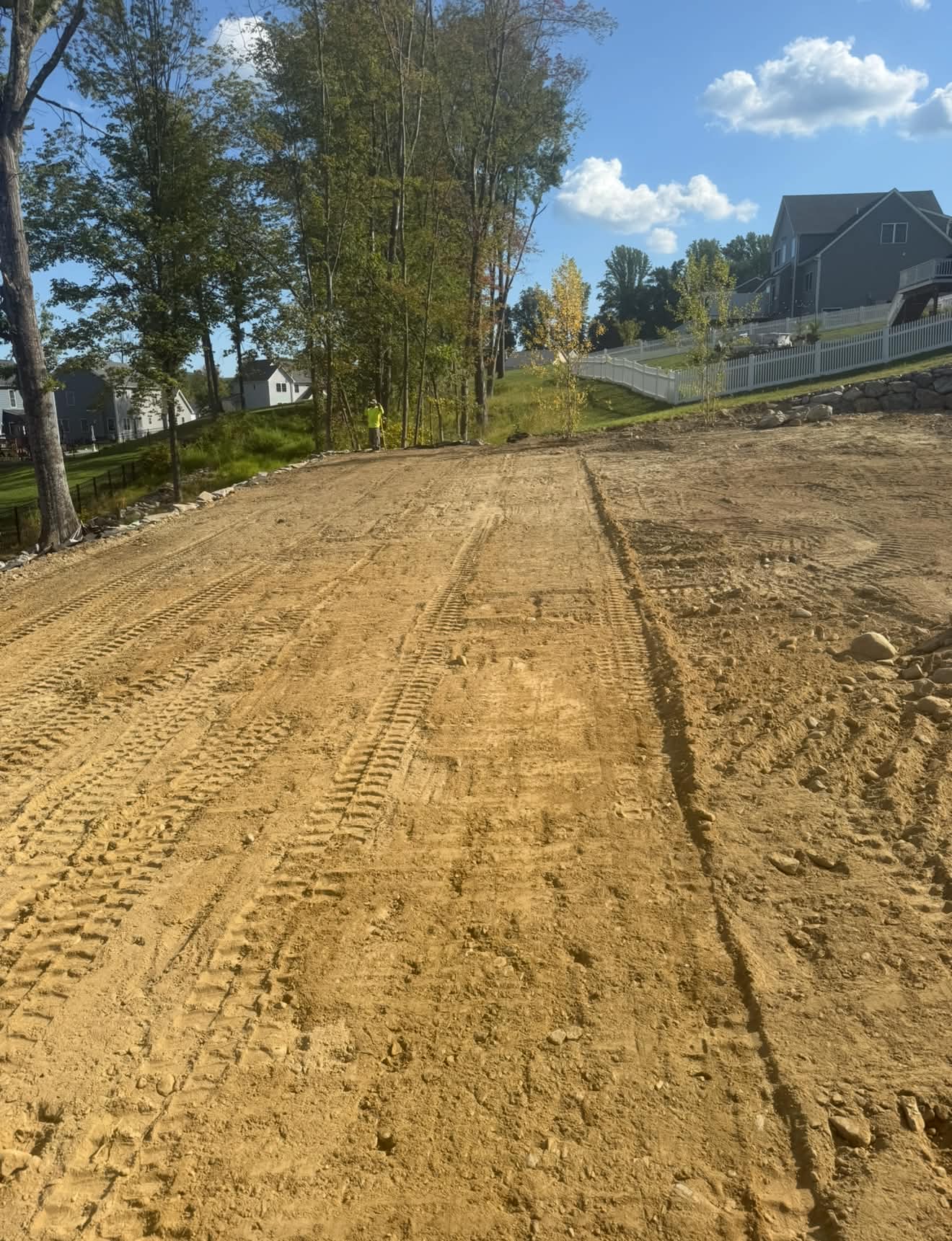 Graded driveway base compacted and shaped