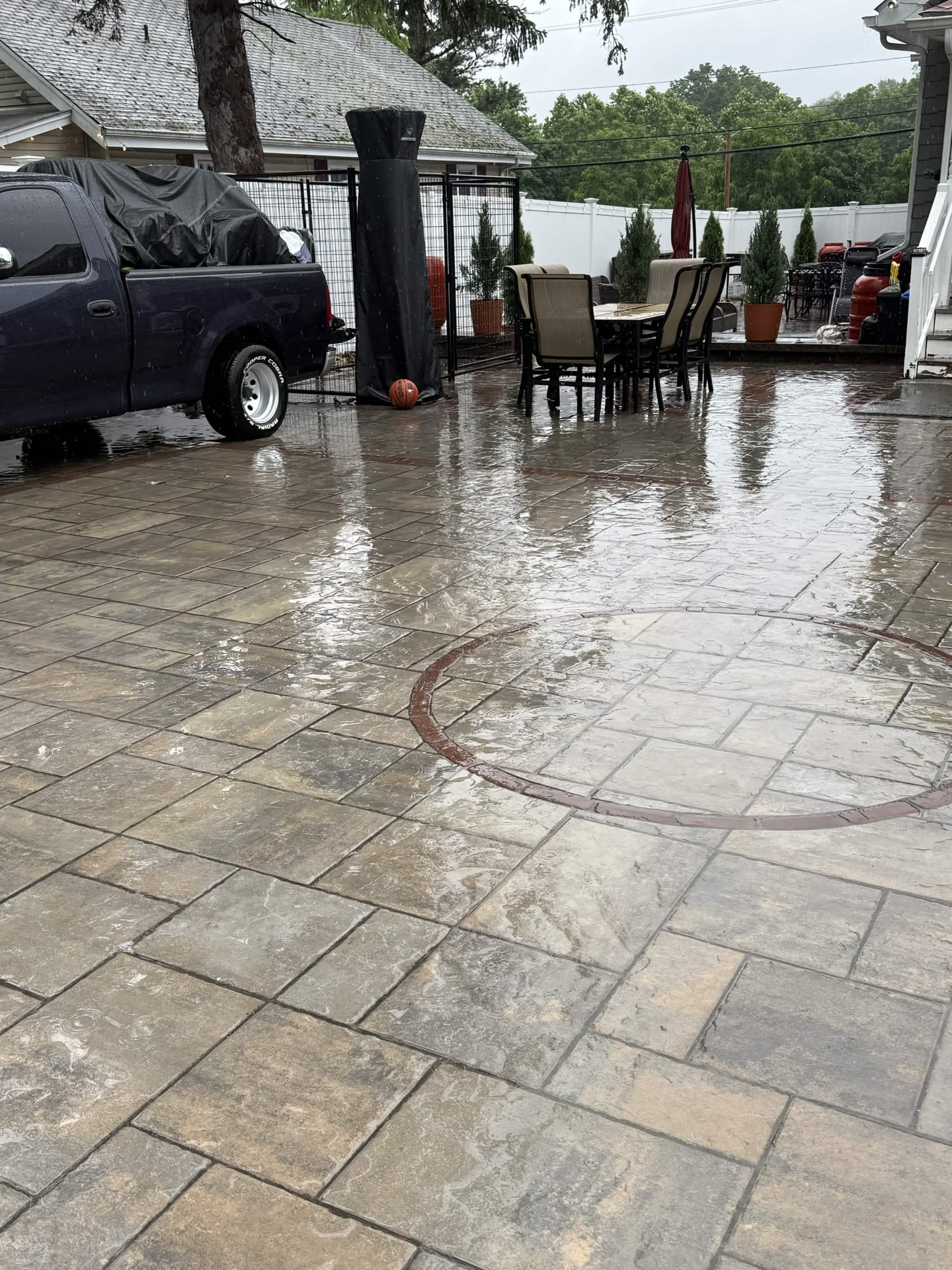 Interlocking paver patio after rain showing tight joints