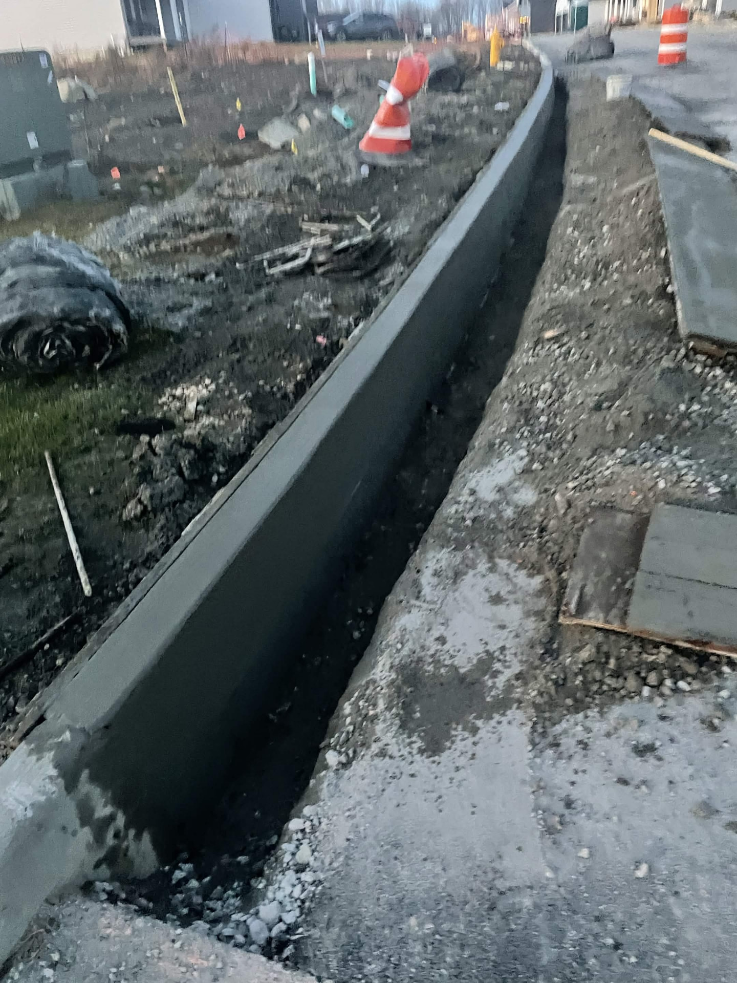 Formed and poured concrete street curb